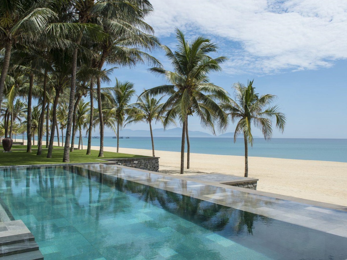 Swimming pool and beach at the Four Seasons Hoi An Nam Hai Vietnam