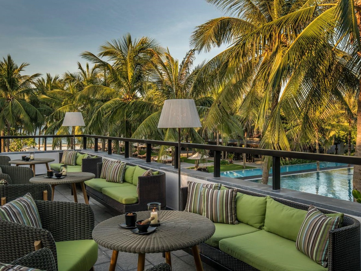 Rooftop seating area overlooking the main pool at luxury resort Four Seasons Nam Hai