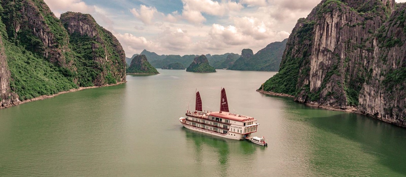 Ginger Ship, a floating boutique hotel, cruising through Lan Ha Bay in the Gulf of Tonkin
