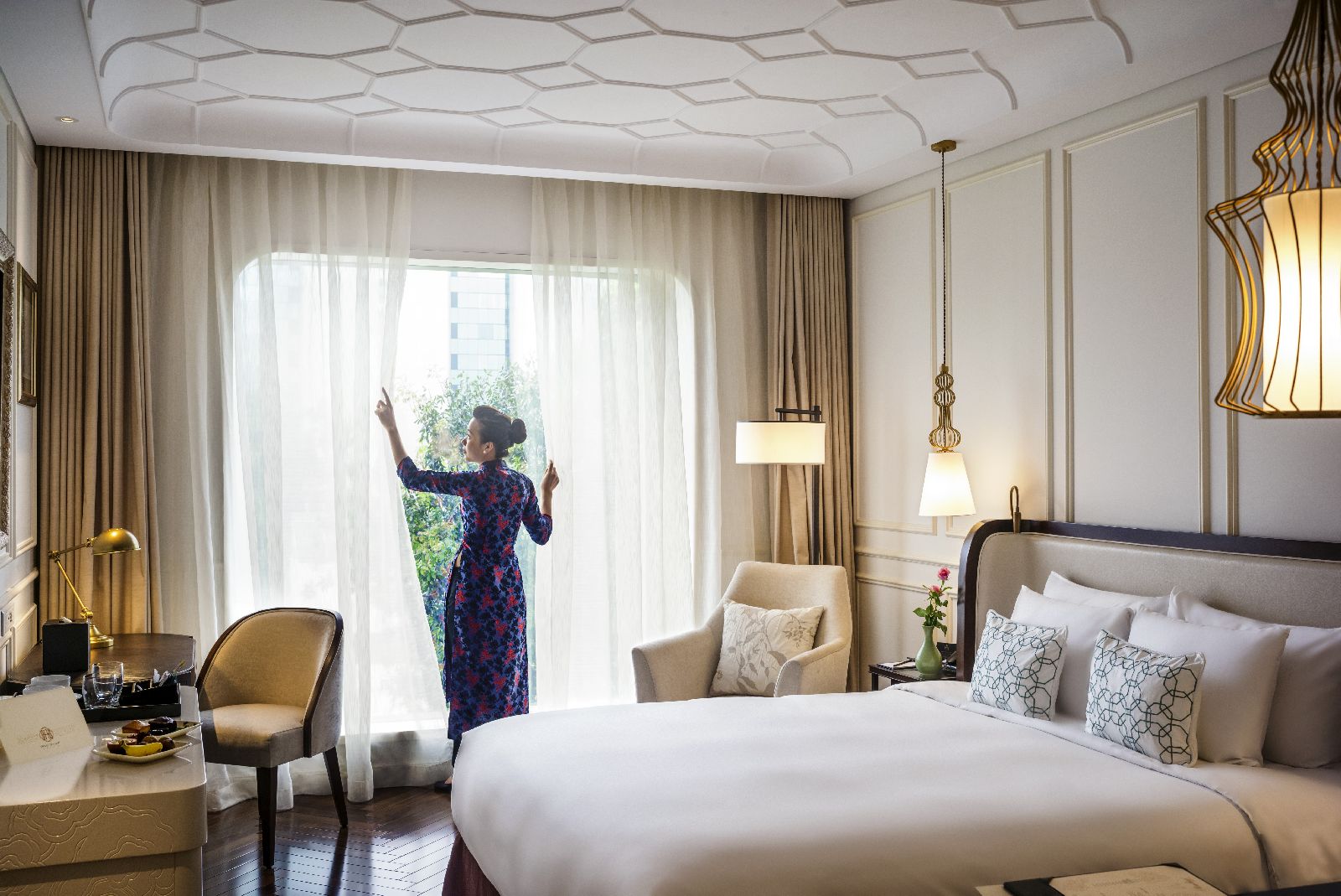 Comfortable guest room at Hotel des Arts Saigon in Vietnam