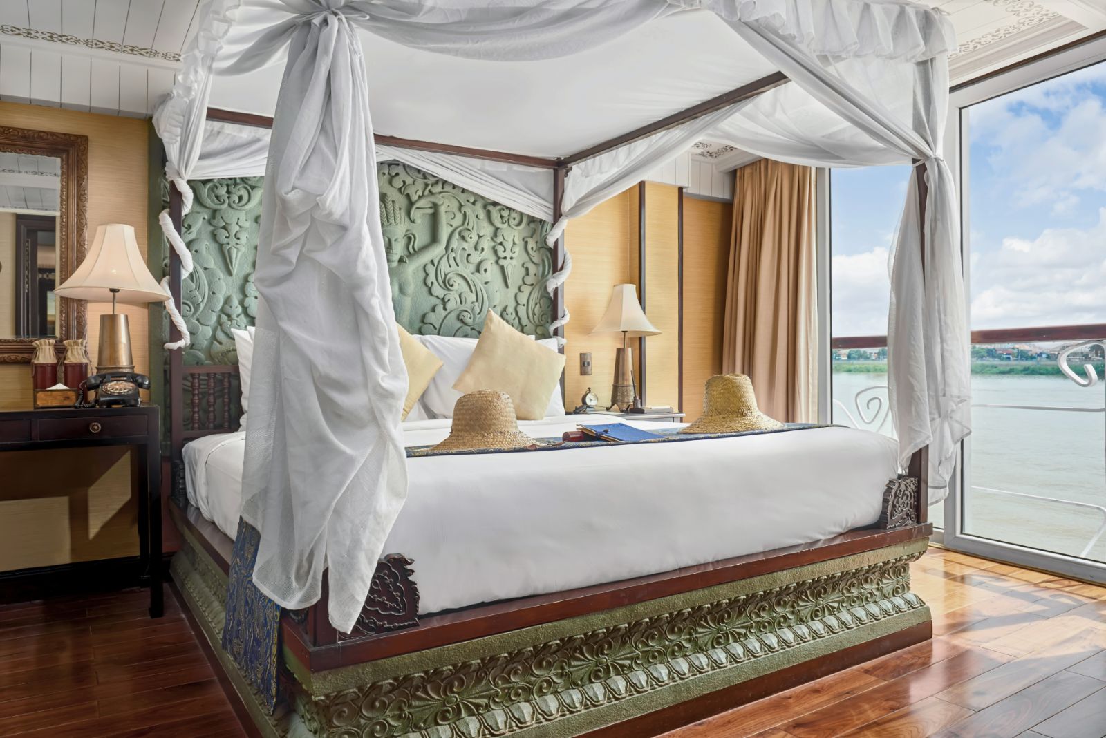 Jayavarman Suite bed onboard the Jayavarman Mekong River cruise in Vietnam