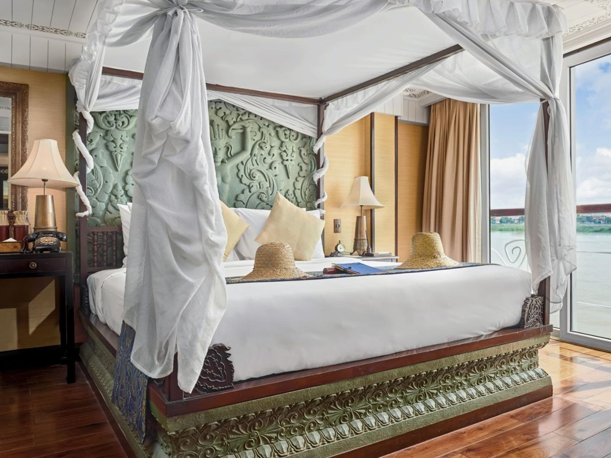 Jayavarman Suite bed onboard the Jayavarman Mekong River cruise in Vietnam
