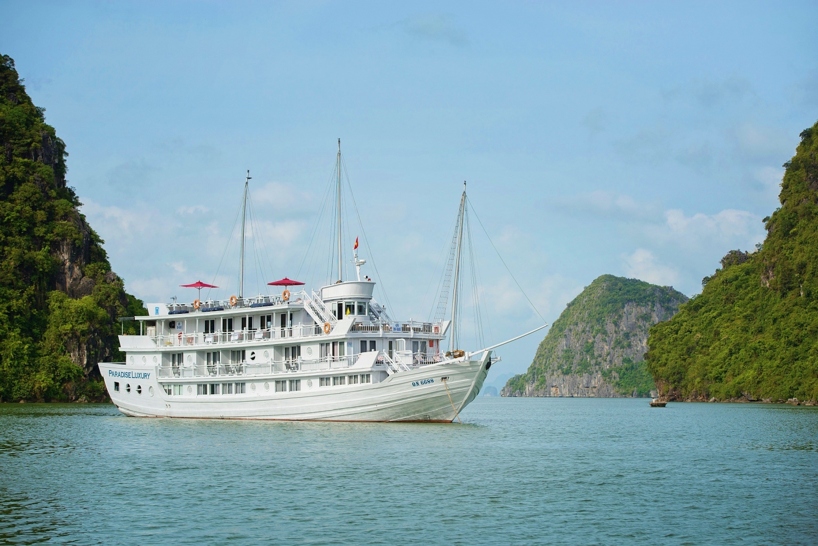 Exterior of Paradise Luxury with karsts in the background of Halong Bay