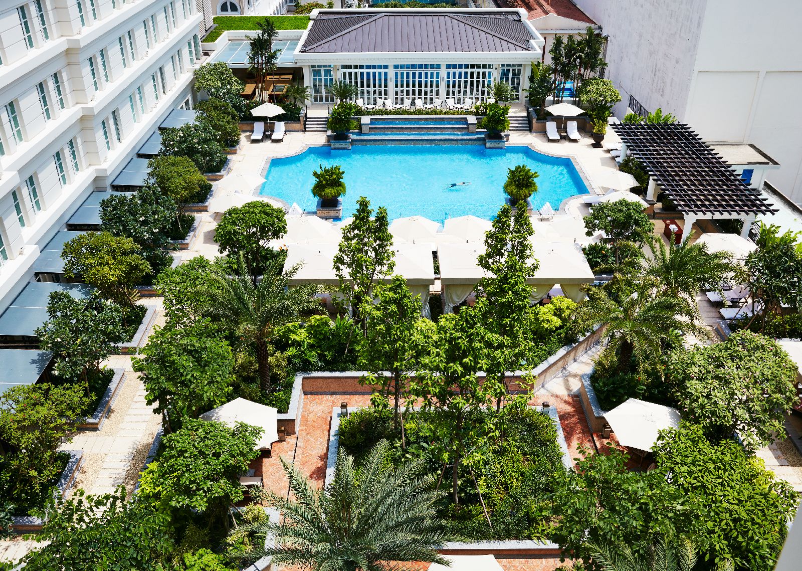 Swimming pool and gardens of the Park Hyatt Saigon in Vietnam