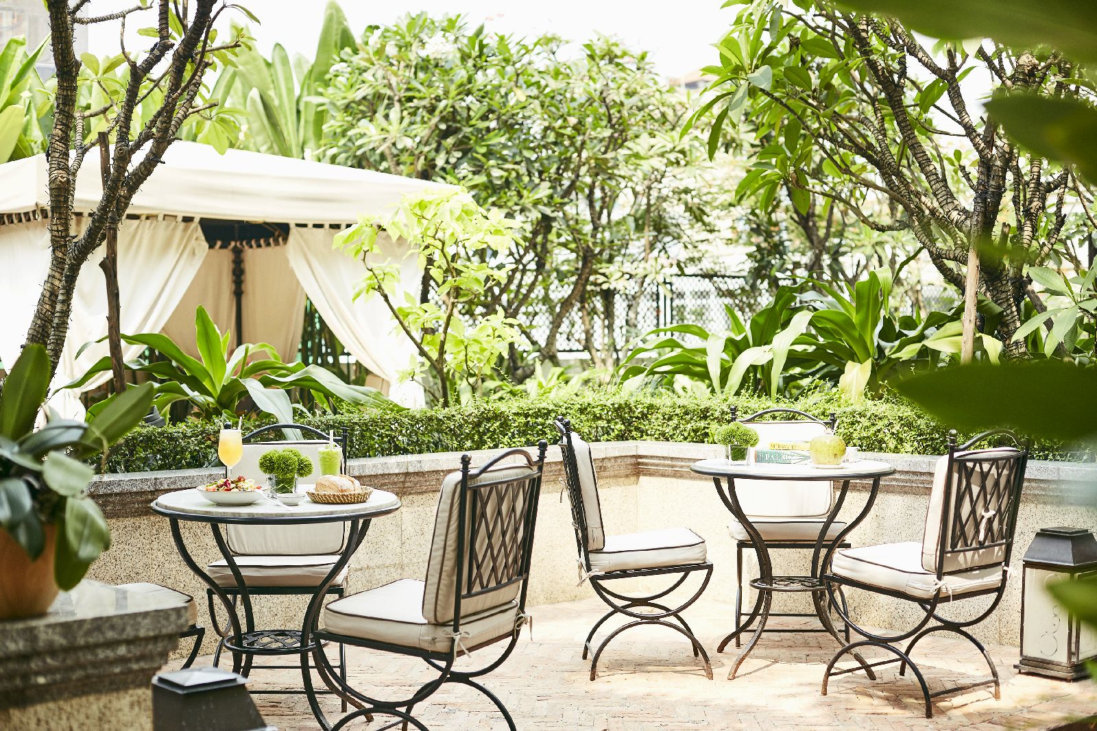 Tree lined terrace at the Park Hyatt Saigon in Vietnam