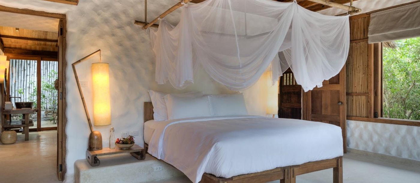 Bedroom in a Beachfront pool villa at luxury resort Six Senses Ninh Van Bay