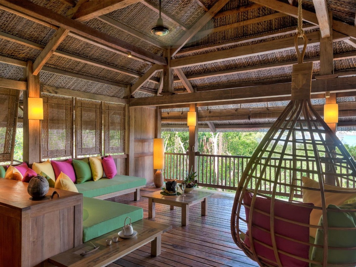 Upper floor seating area in a beachfront pool villa at luxury resort Six Senses Ninh Van Bay