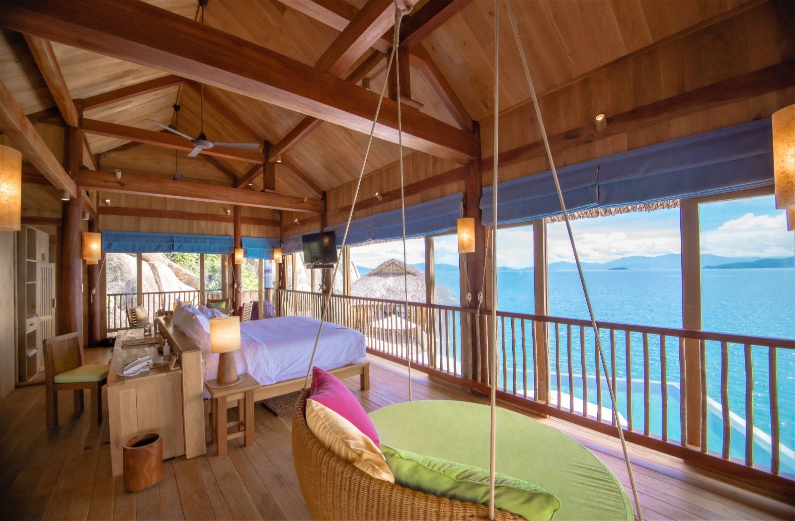 Bedroom looking out to the ocean at luxury resort Six Senses Ninh Van Bay