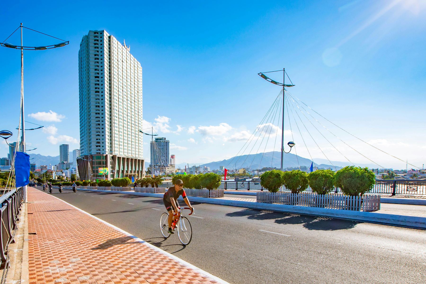 A cyclist on the Nha Trang Bridge in Vietnam