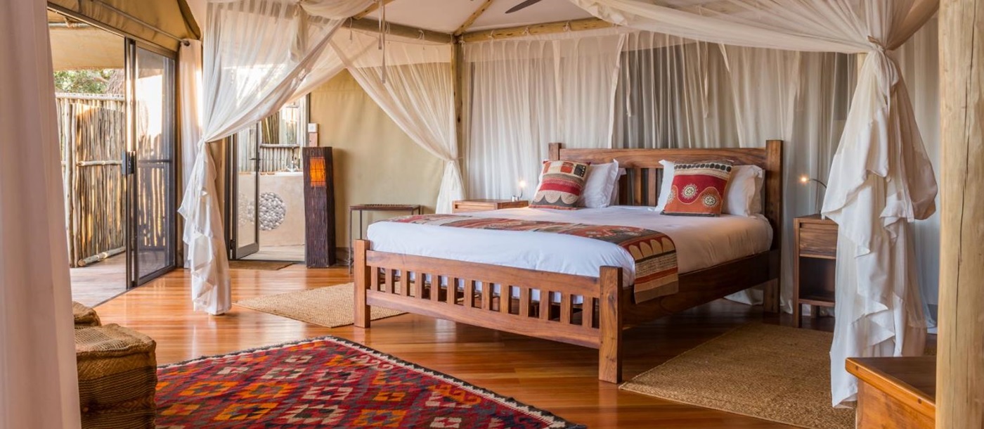 Bedroom of a tented suite at Anabezi camp in the Lower Zambezi, Zambia