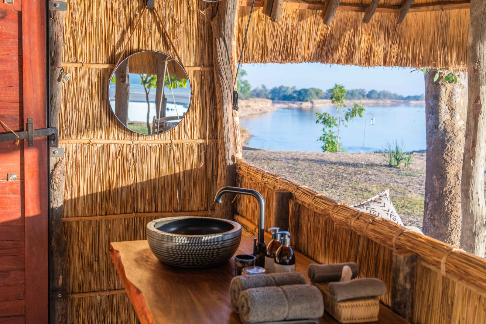 Bathroom with a view of the river at Kakuli Bush Camp in Zambia's South Luangwa National Park