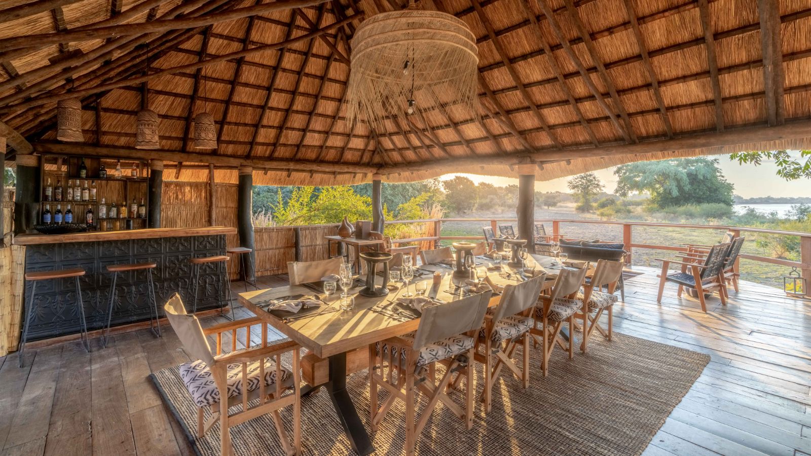 Dining and bar area overlooking the river at Kakuli Bush Camp in Zambia's South Luangwa National Park