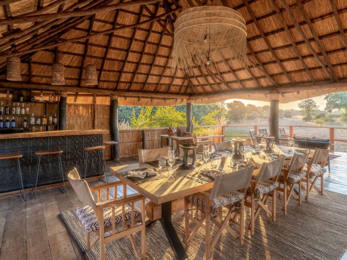 Dining and bar area overlooking the river at Kakuli Bush Camp in Zambia's South Luangwa National Park