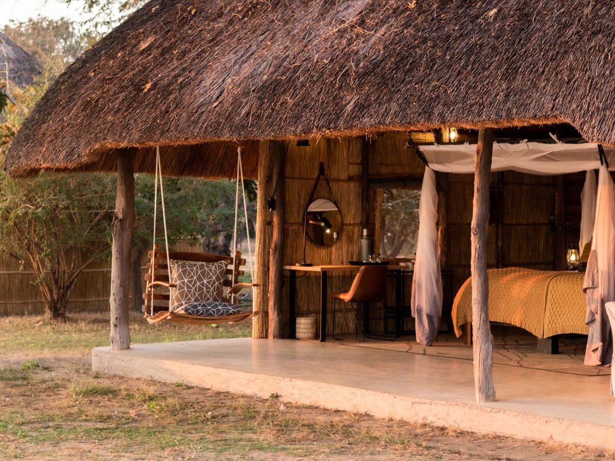 Swing on patio area of luxury chalet at Kakuli Bush Camp in Zambia's South Luangwa National Park