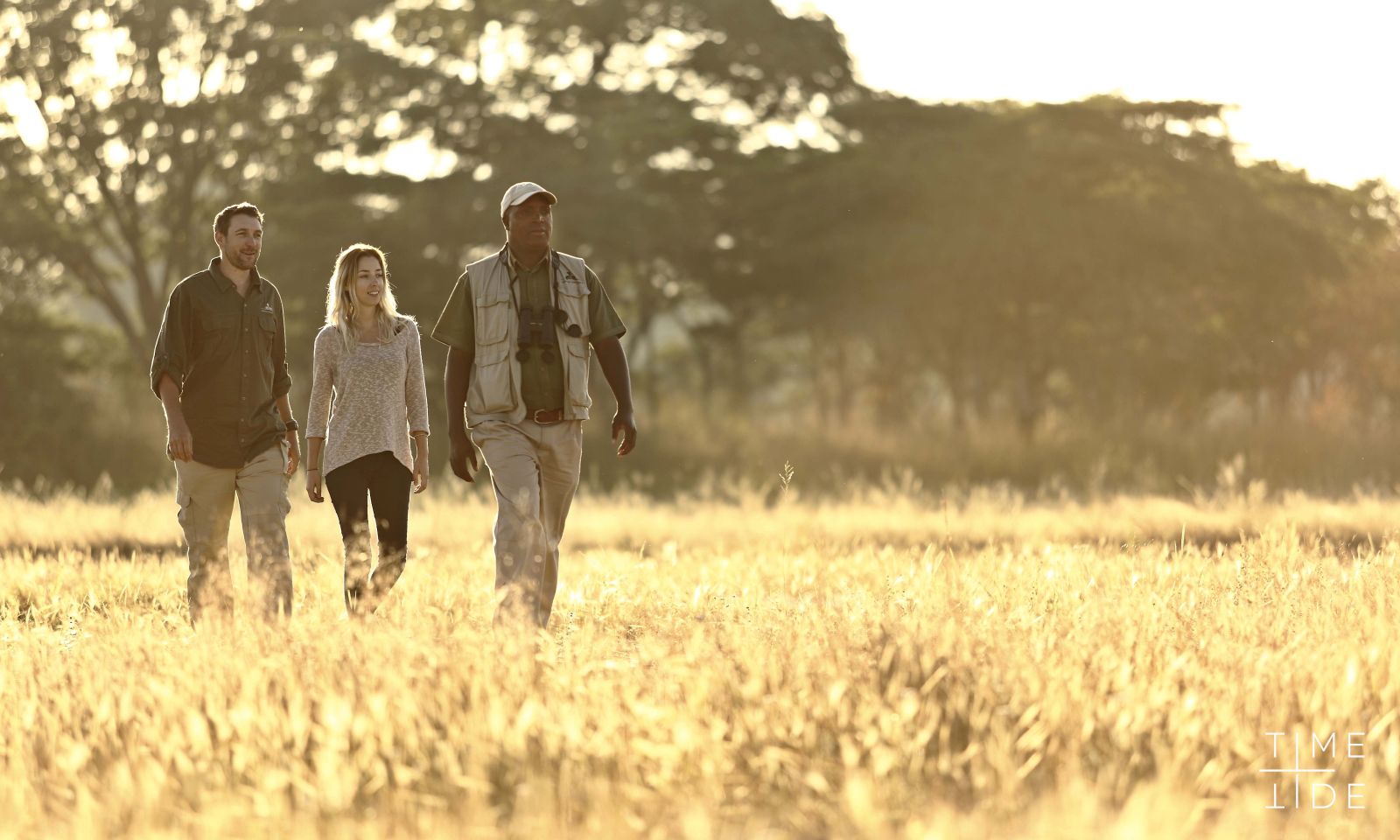 Guests on a walking safari at luxury safari camp Kakuli Bush Camp in Zambia's South Luangwa National Park