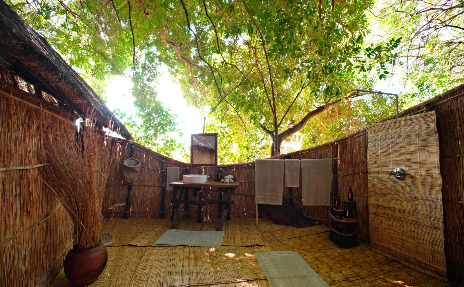 Open Air en-suite bathroom of a tented suite at luxury safari camp Luwi Bush Camp in Zambia