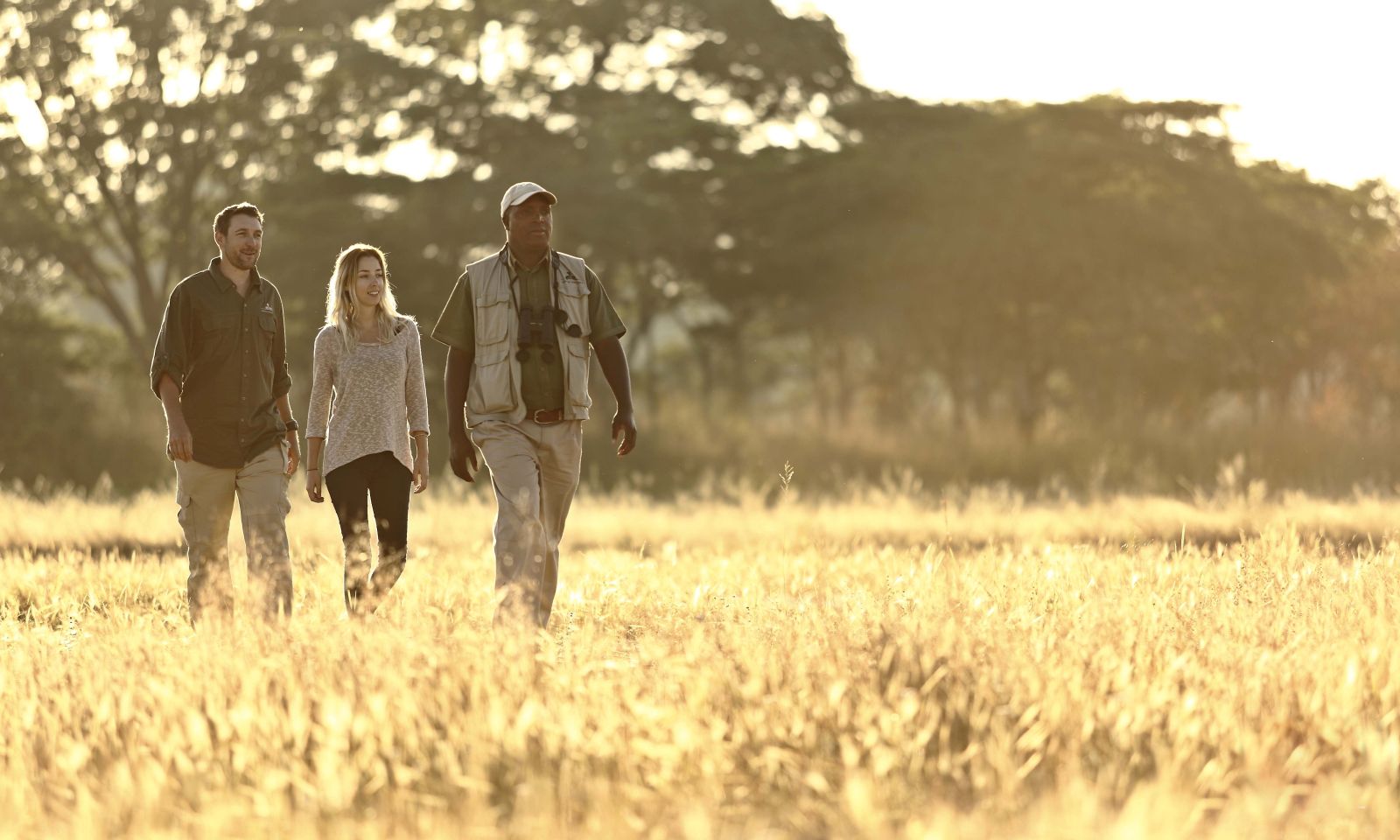 Guests enjoying a guided walk at luxury safari camp Luwi Bush Camp in Zambia