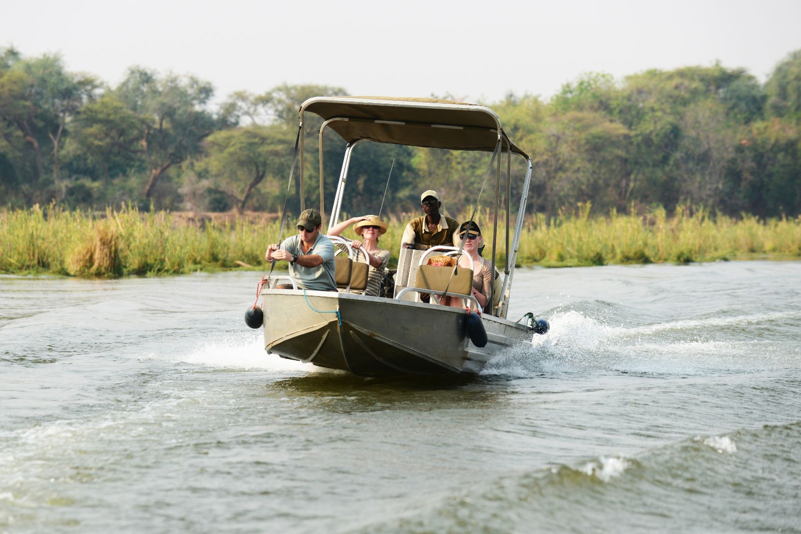 A boat transfer on the Zambezi to Potato Bush Camp