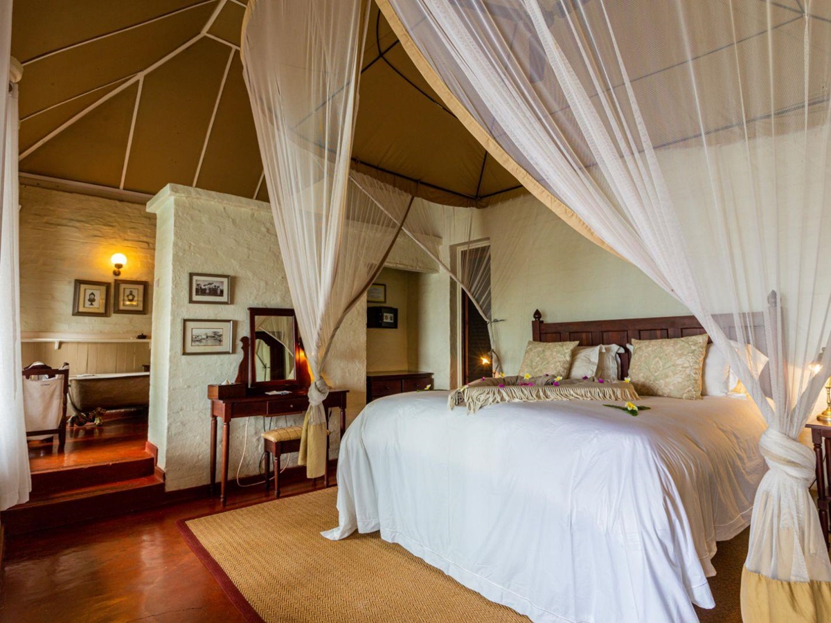 Luxury Family River Suite bedroom at The River Club, Livingstone