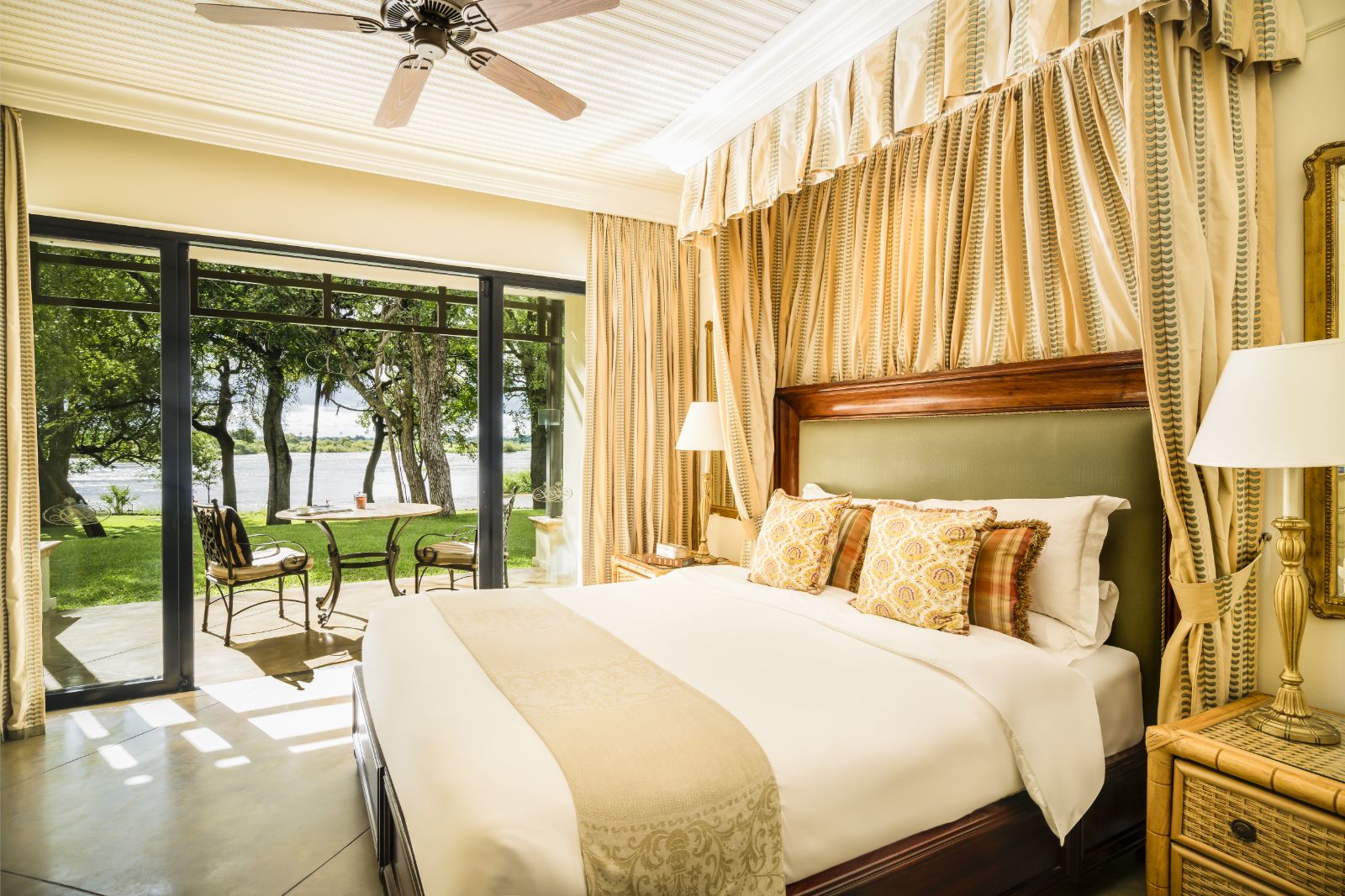 Guest bedroom and deck at The Royal Livingstone at Victoria Falls in Zambia