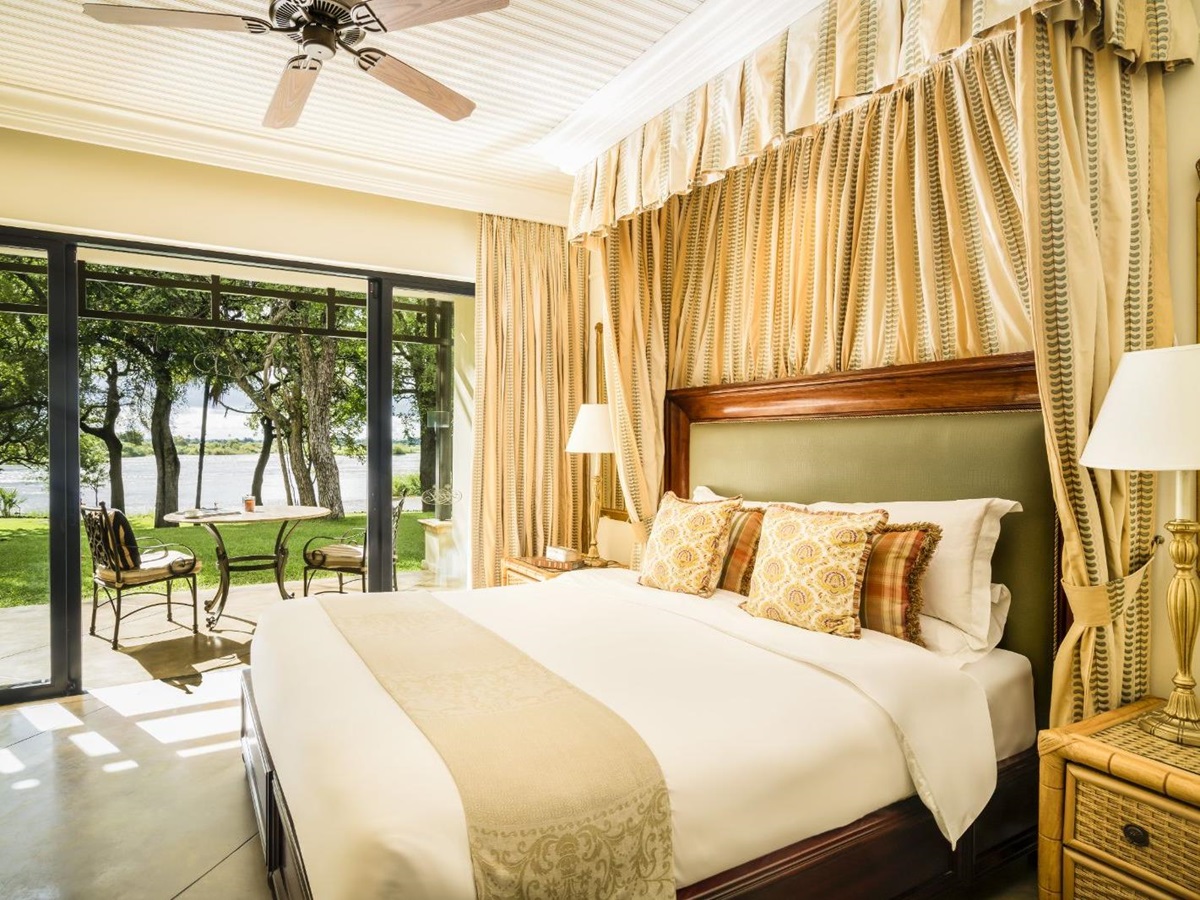 Guest bedroom and deck at The Royal Livingstone at Victoria Falls in Zambia