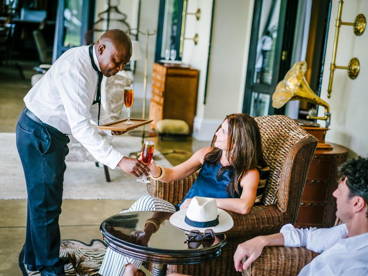 Guests receiving drinks at The Royal Livingstone at Victoria Falls in Zambia