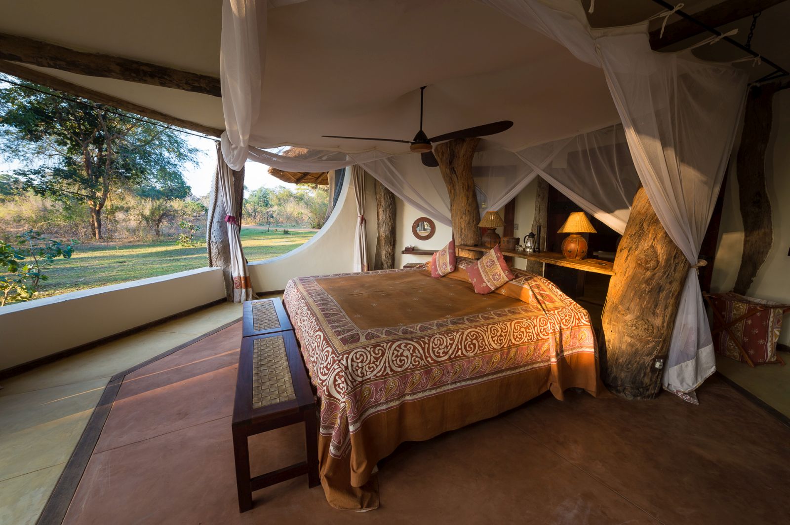 View of the bush from the open bedroom at the Luangwa Safari House in Zambia