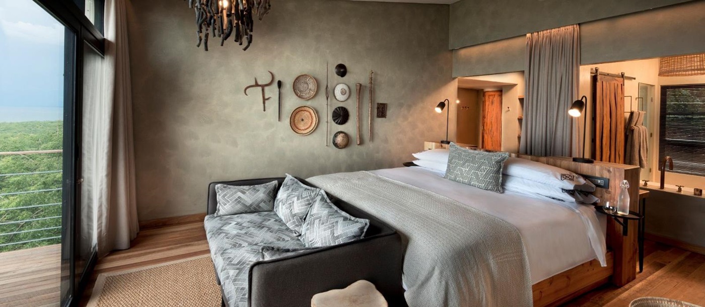 Bedroom of a Lake View Room at luxury safari lodge Bumi Hills in Zimbabwe