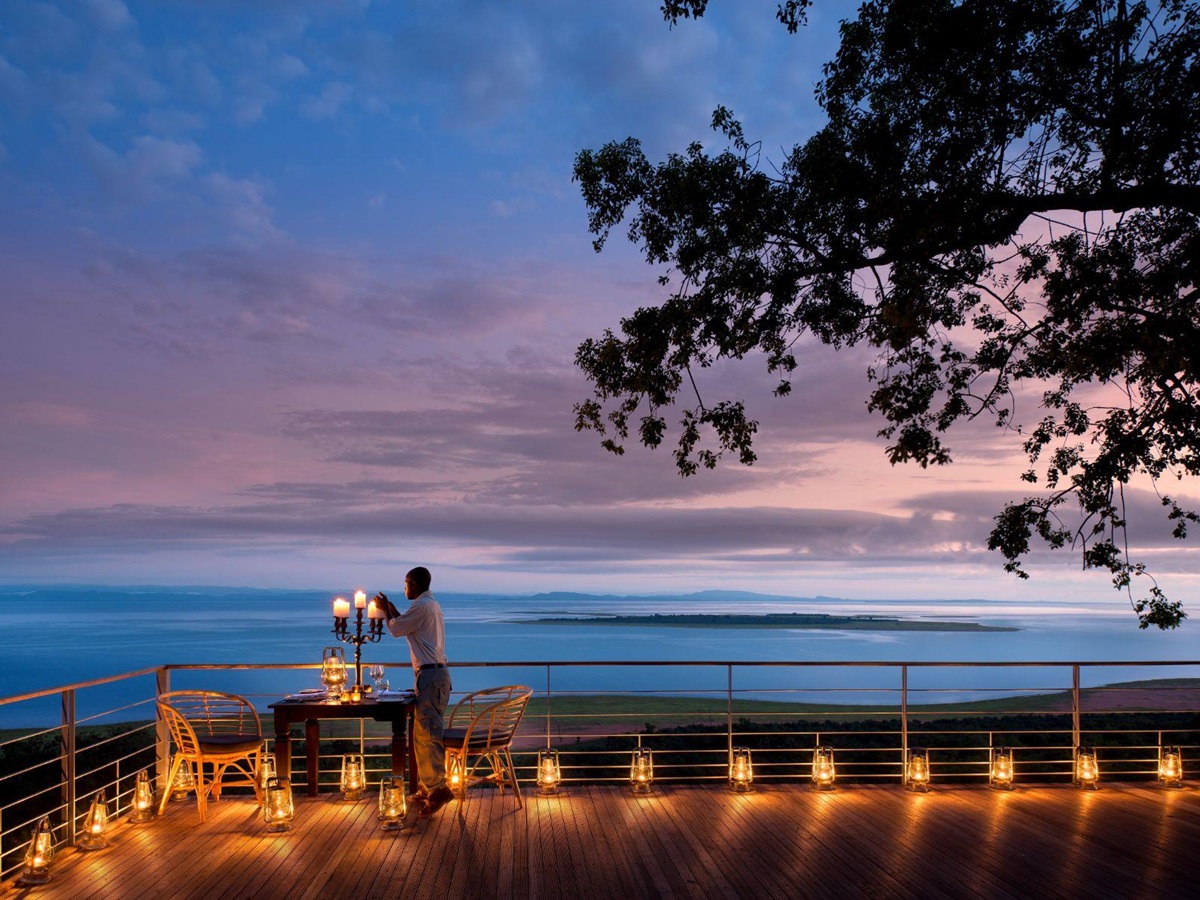 Private dinner set up on the deck at luxury safari lodge Bumi Hills in Zimbabwe