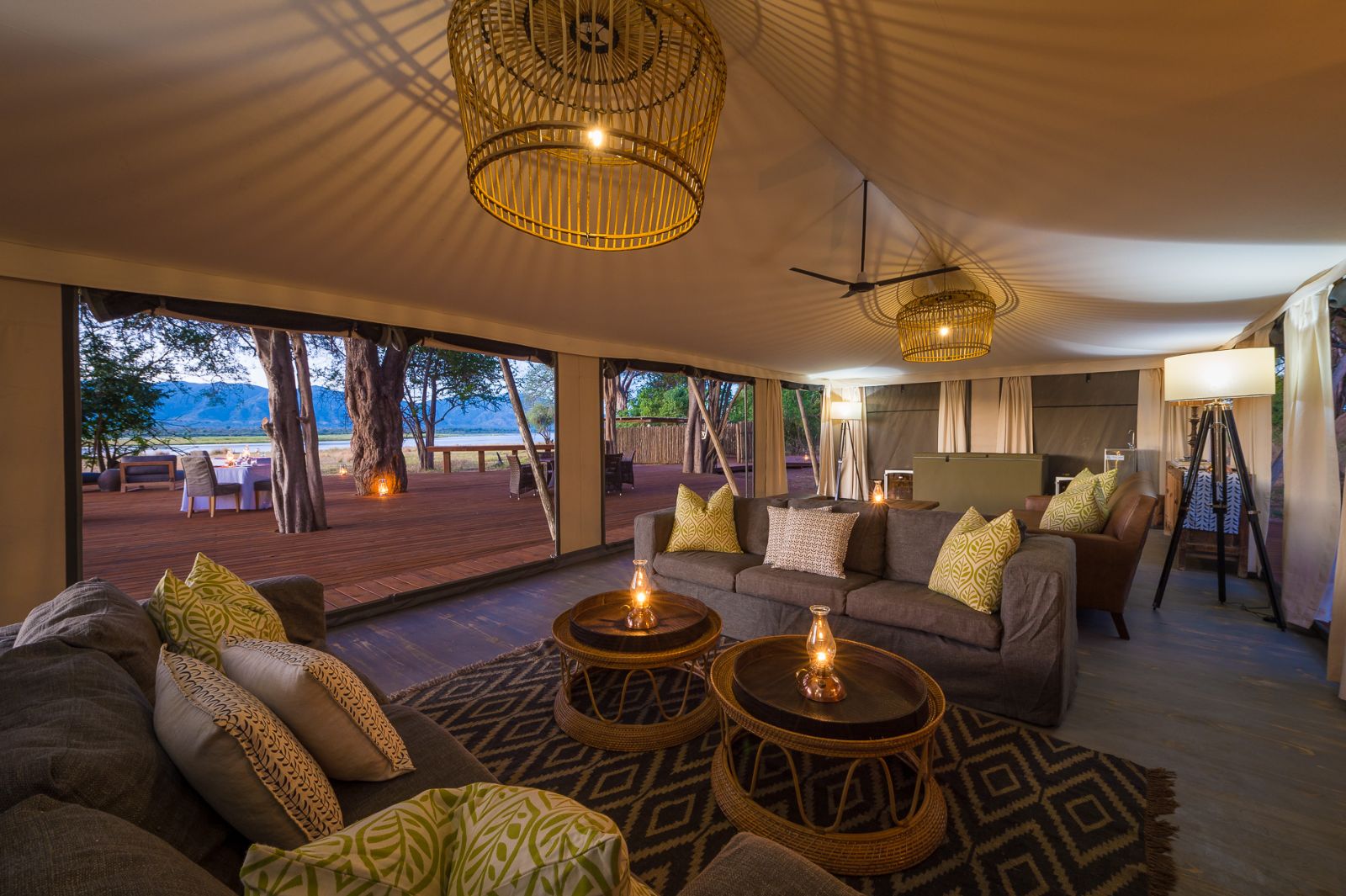 Tented lounge area with decked terrace at luxury camp Ruckomechi
