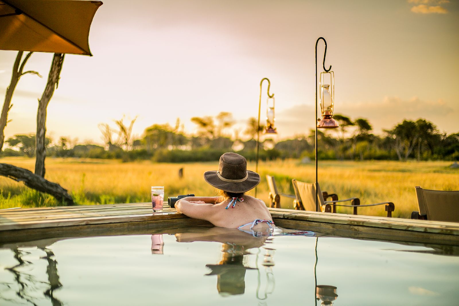 Guest enjoying the swimming pool at The Hide safari lodge Zimbabwe