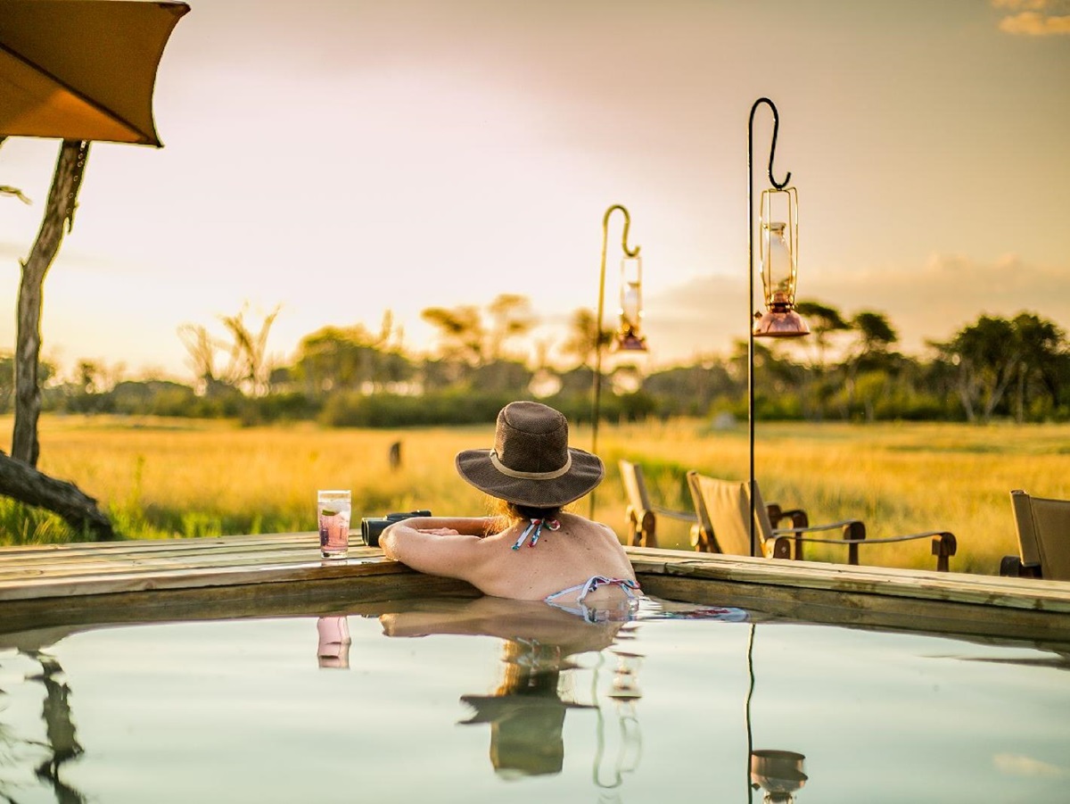 Guest enjoying the swimming pool at The Hide safari lodge Zimbabwe