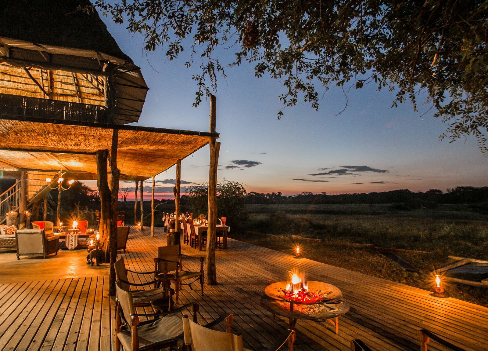 Terrace illuminated by night at The Hide safari lodge Zimbabwe