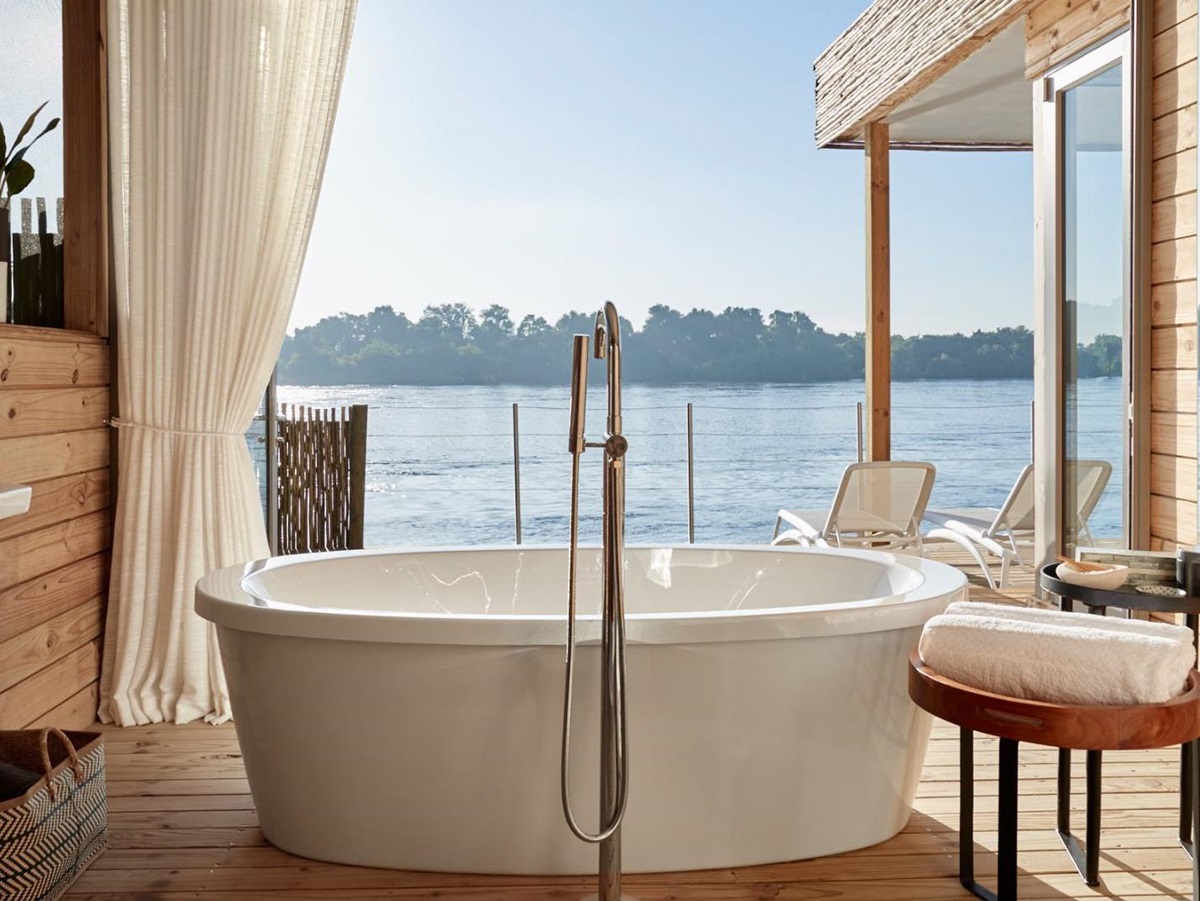 Bathroom with freestanding tub at Victoria Falls River Lodge in Zambezi National Park in Zimbabwe
