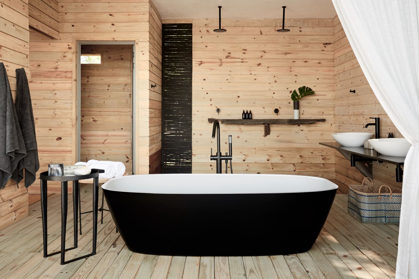 Starbed treehouse freestanding bathtub at Victoria Falls River Lodge in Zambezi National Park in Zimbabwe