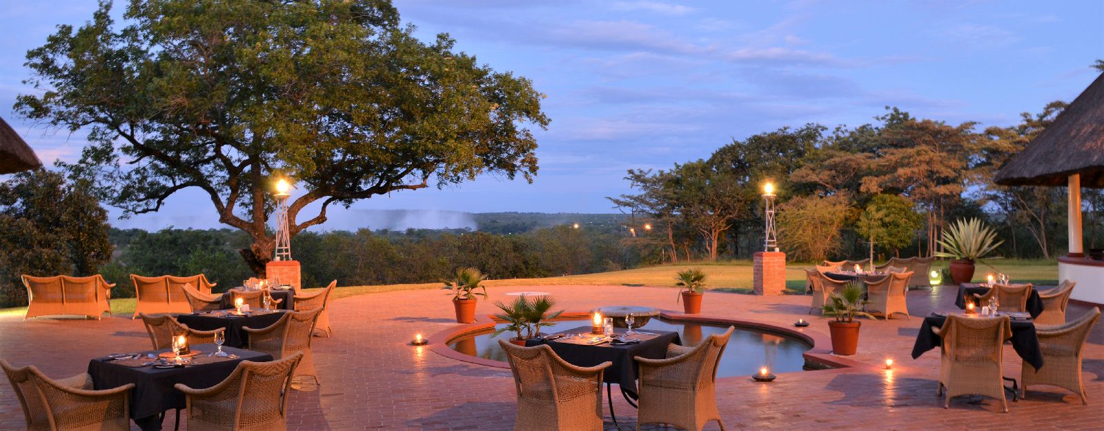 Outdoor dining with Falls view at The Victoria Falls Hotel