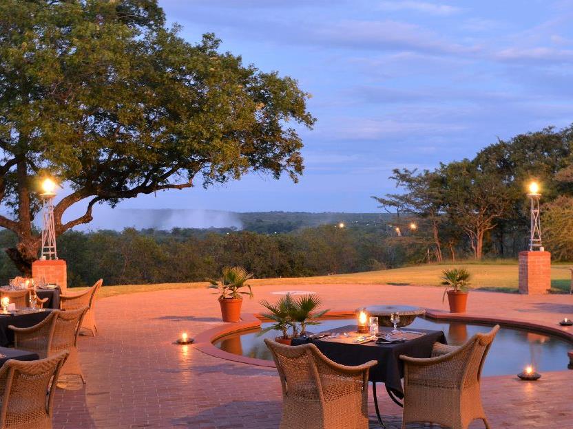 Outdoor dining with Falls view at The Victoria Falls Hotel