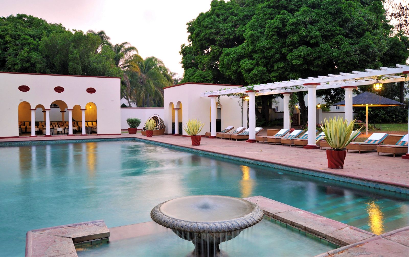The swimming pool at The Victoria Falls Hotel in Zimbabwe