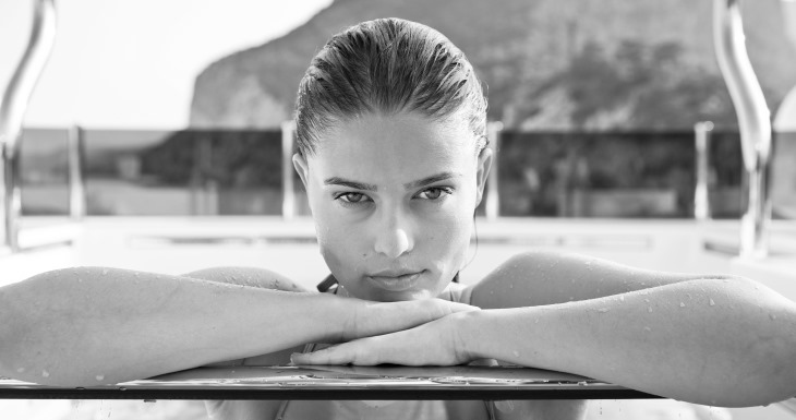 Lady in swimming pool of private villa rental