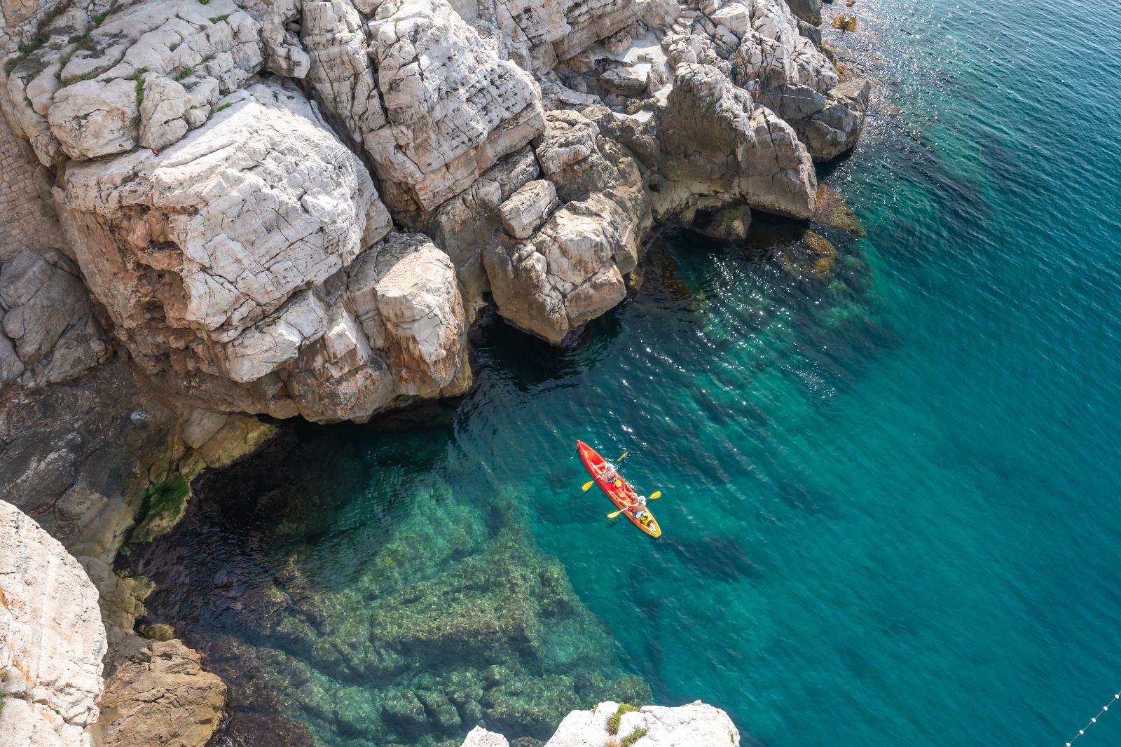 Aerial view of a couple kayaking in the Adriatic