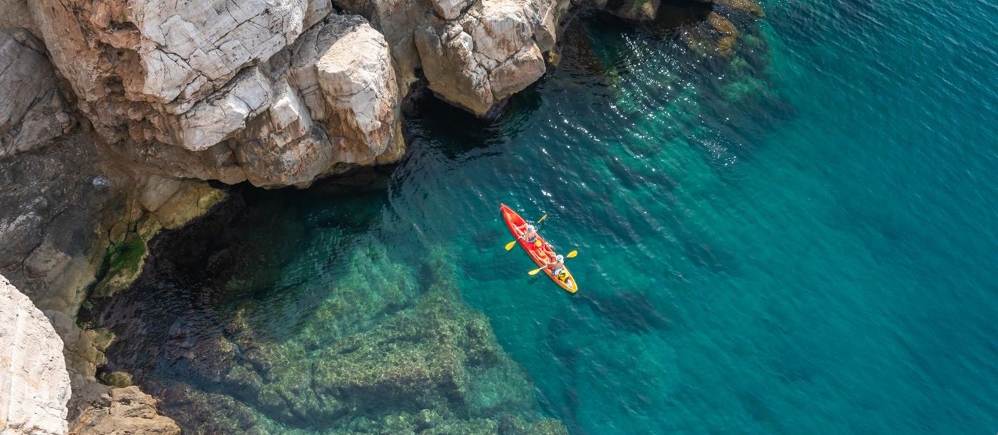 Aerial view of a couple kayaking in the Adriatic