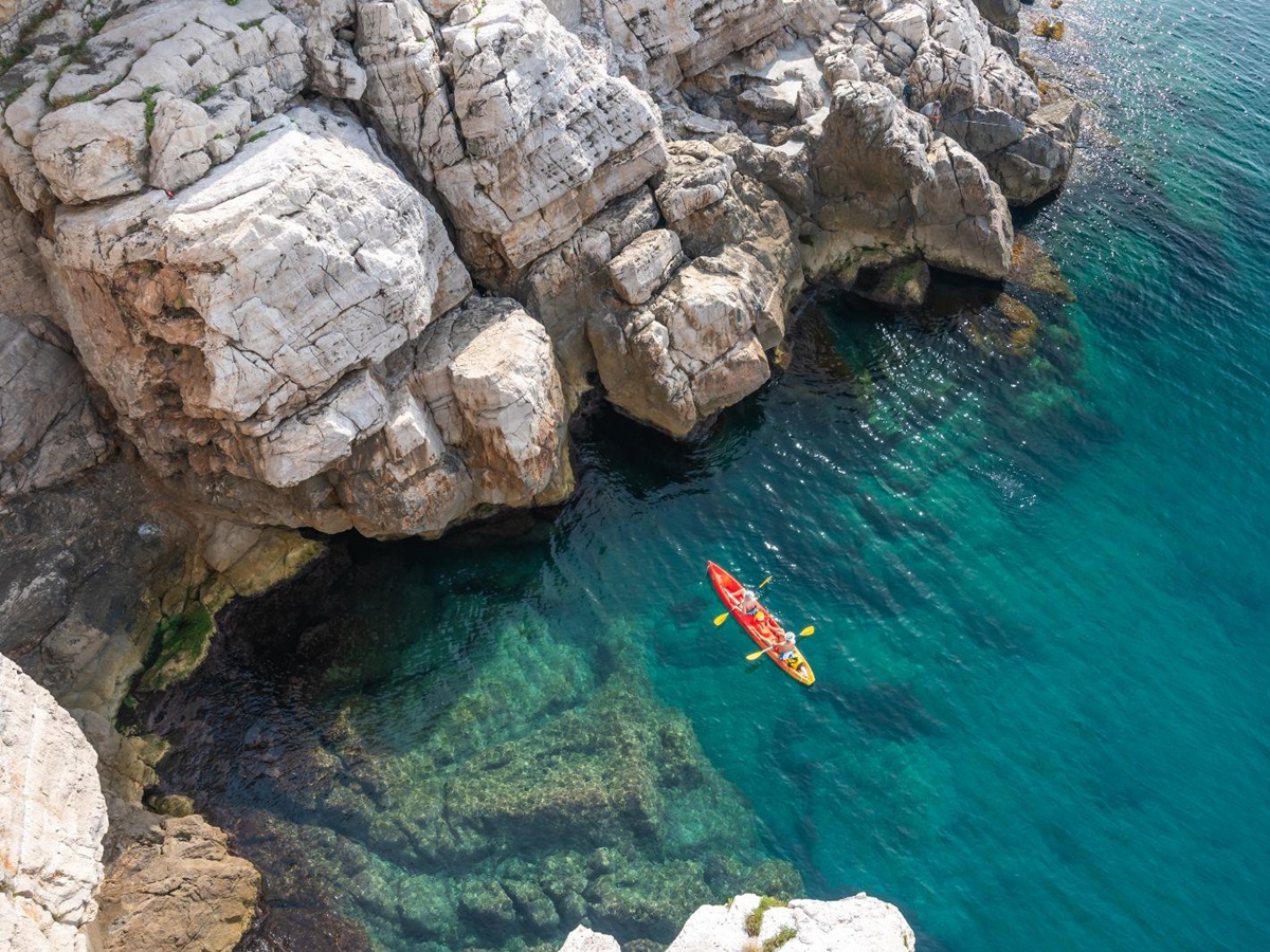 Aerial view of a couple kayaking in the Adriatic