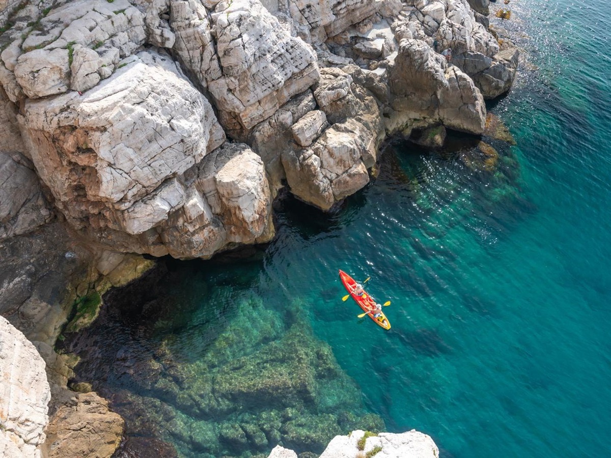 Aerial view of a couple kayaking in the Adriatic