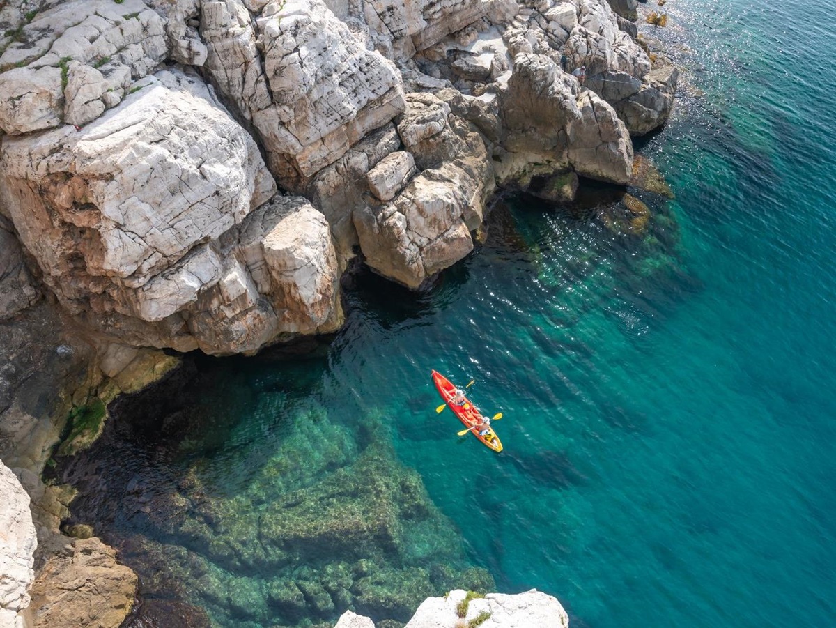 Aerial view of a couple kayaking in the Adriatic