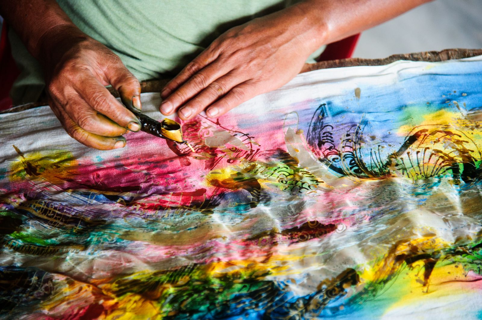 Close up of colourful batik making with waz