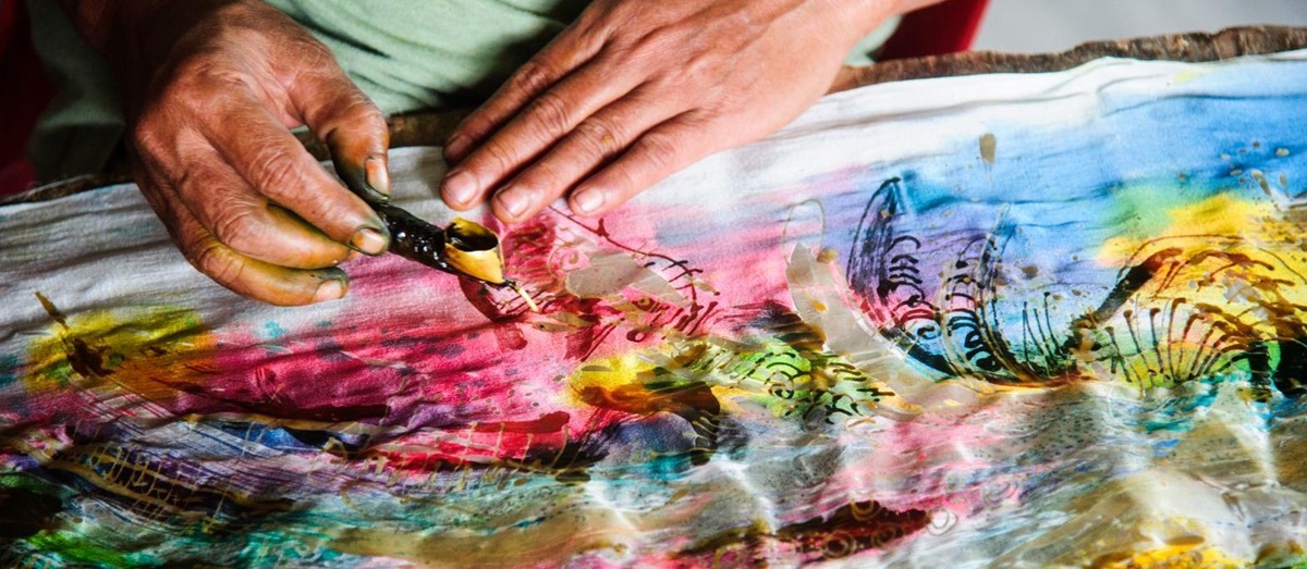 Close up of colourful batik making with waz