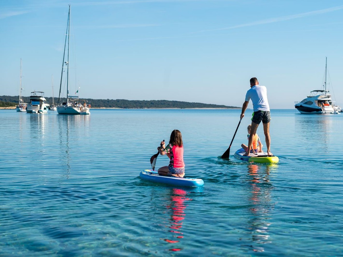 A family paddleboarding on the ocean