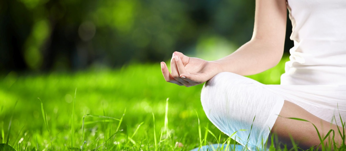 A lady in the lotus yoga position
