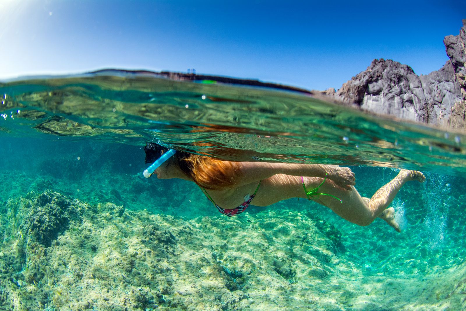 A woman snorkelling in the Mediterranean