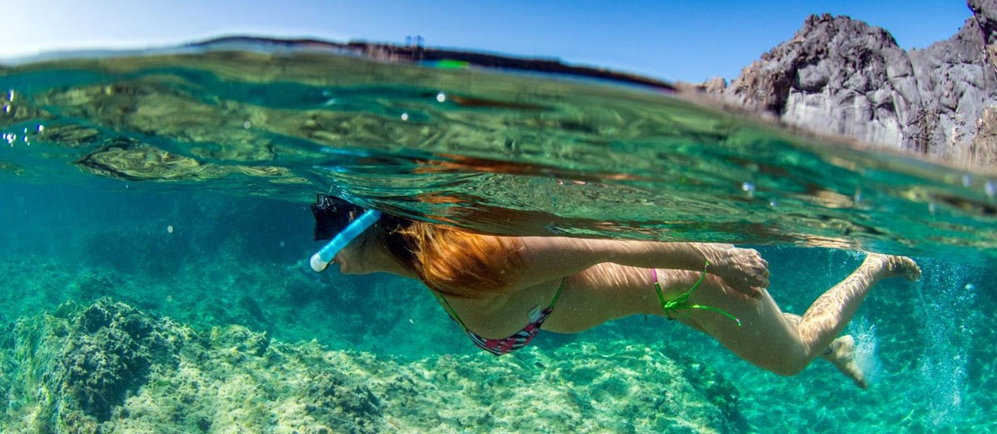 A woman snorkelling in the Mediterranean